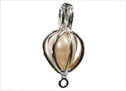 Place the pearl within the pendant.